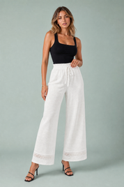 Pantalon blanc taille haute dentelle | Vue de face | Lounelle Paris