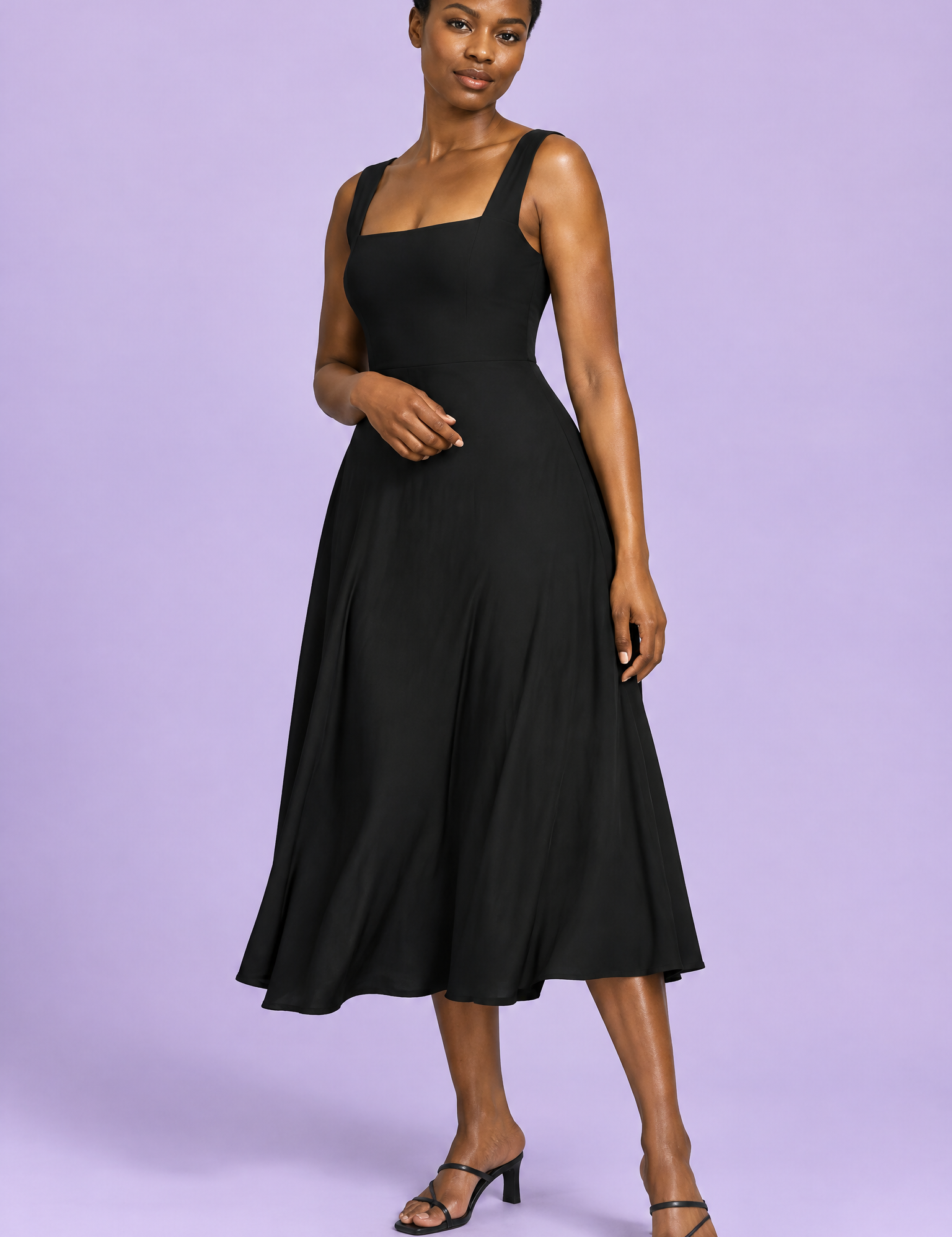Robe midi noire à fines bretelles et jupe ample | Vue de face | Lounelle Paris