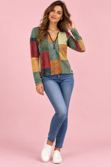 Top verde com estampado patchwork e fecho