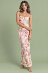 Vestido midi branco-sujo com padrão floral, detalhe torcido e corte assimétrico