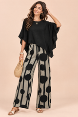 Conjunto de calças preto com padrão de bolinhas